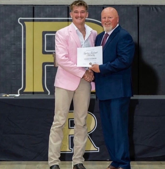 Cayden McBryde receiving scholarship award